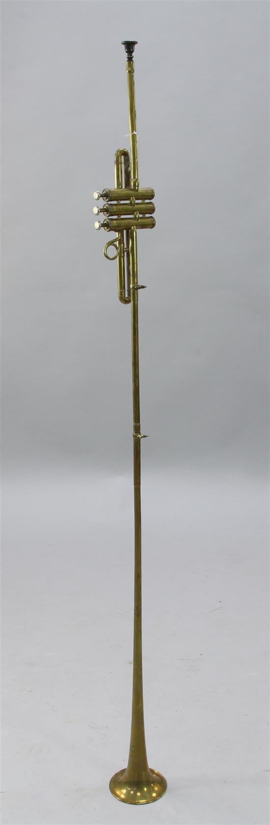 An Aida brass trumpet, by Boosey & Hawkes, 54.5in.